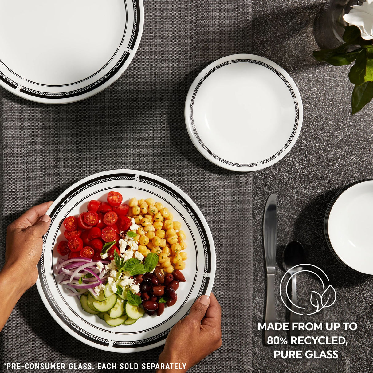 Brasserie dinnerware on table top with text made from up to 80% recycled, pure glass