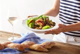  Dazzlig white meal bowl shown holding a salad