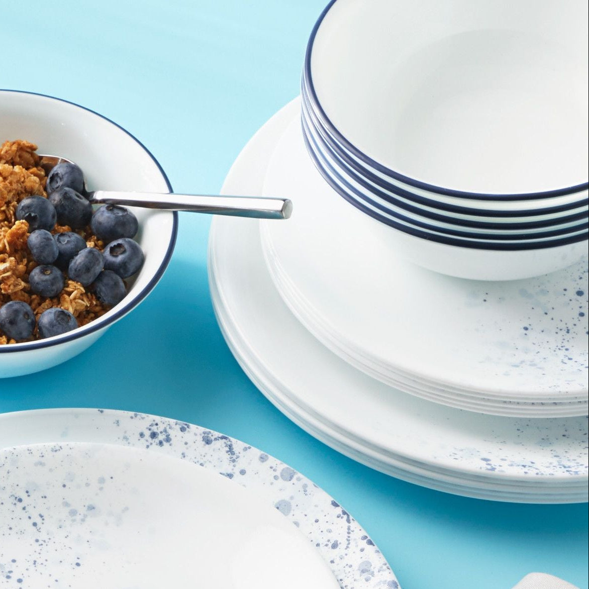  Indigo Speckle dinner, salad plate & cereal bowls on table