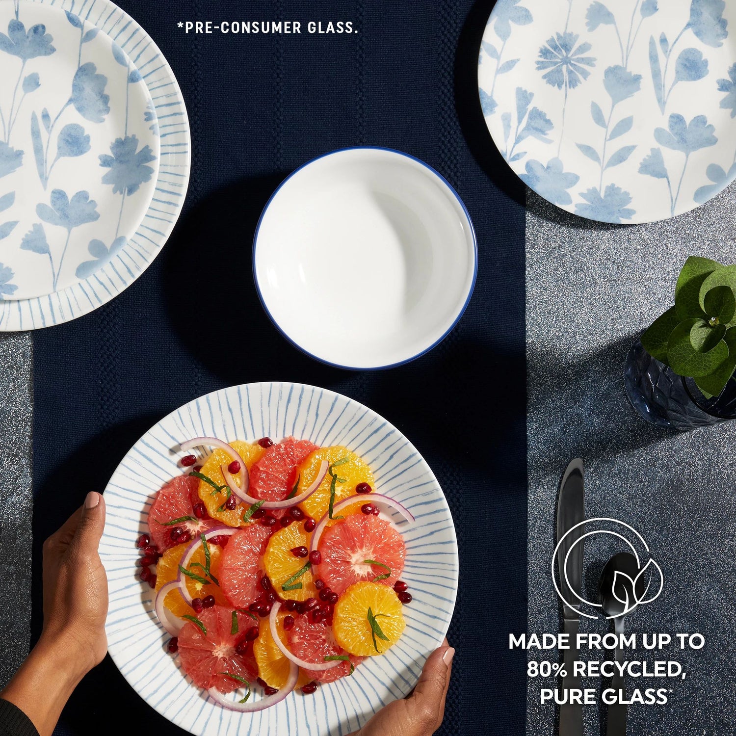  Botanical Stripes Dinnerware on tabletop with text made from up to 80% recycled pure glass